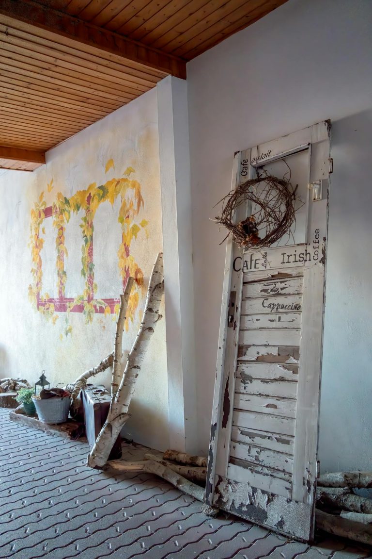 A vintage door with rustic decor in a cozy indoor setting, showcasing charm and character.